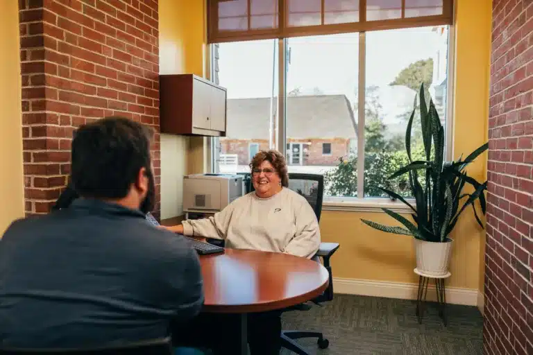 PeoplesChoice employee assists a member at the Biddeford branch.
