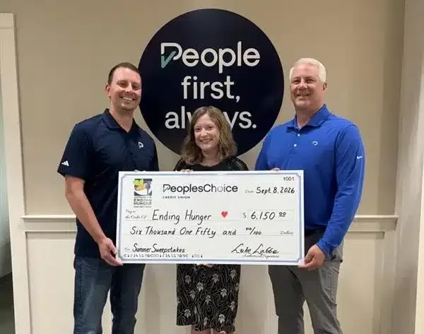 PeoplesChoice Credit Union COO, Dan Dallaire (right) and Director of Marketing, Jacob Ouellette (left) present VP of Outreach & Strategic Initiatives for the Maine Credit Union League, Jennifer Burke (center), with a check benefiting the Campaign for Ending Hunger after its recent Summer Sweepstakes. 